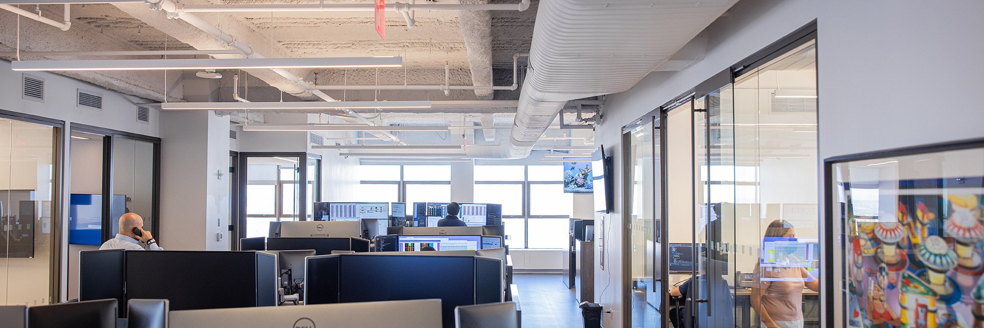 Office Image with desks and employees